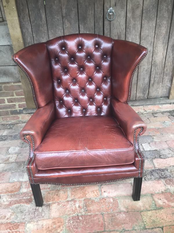 Vintage Ox blood Chesterfield arm chair .
