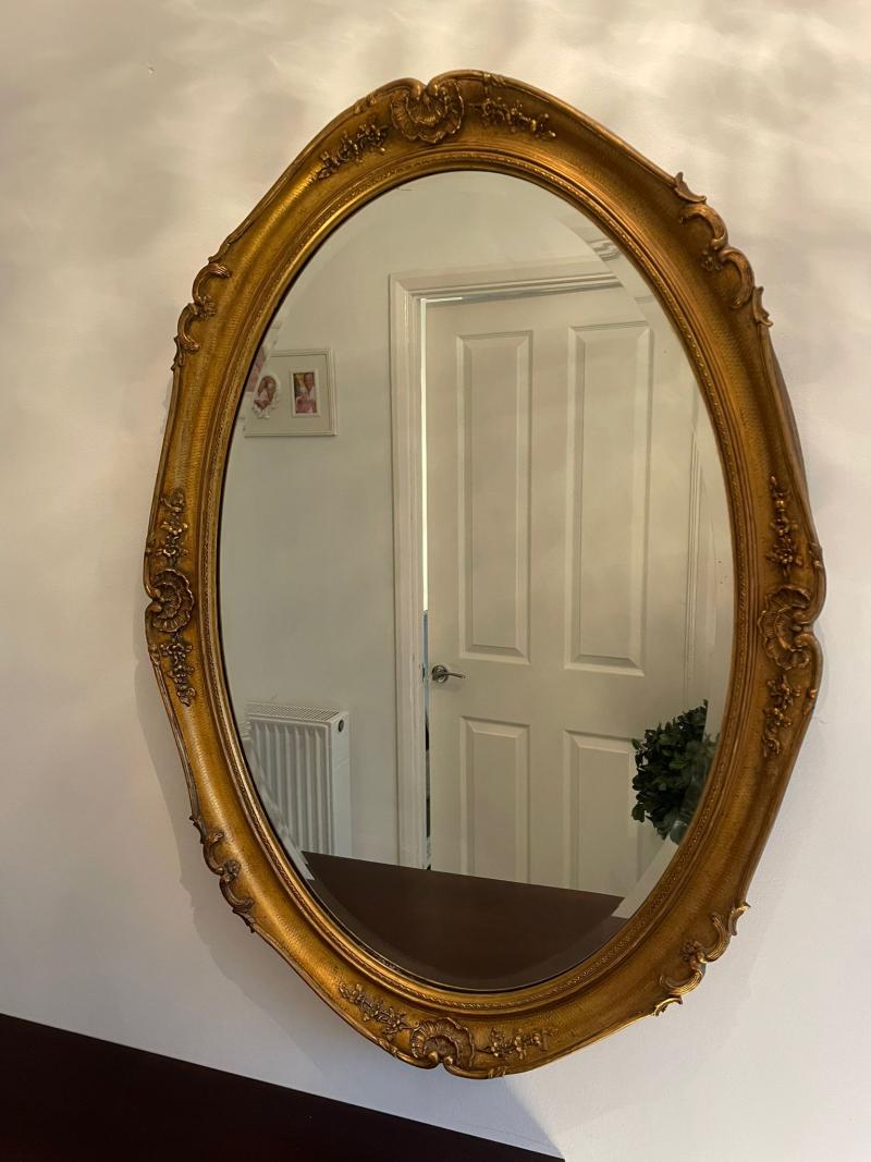 Very large vintage oval gilt mirror